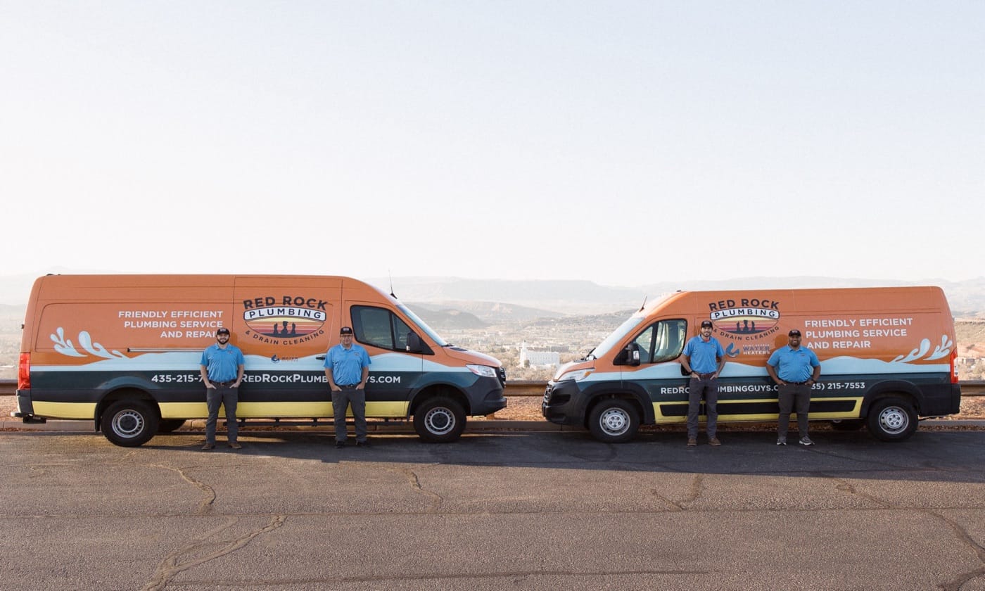 Red Rock Plumbing team with branded service vans in St. George, Utah
